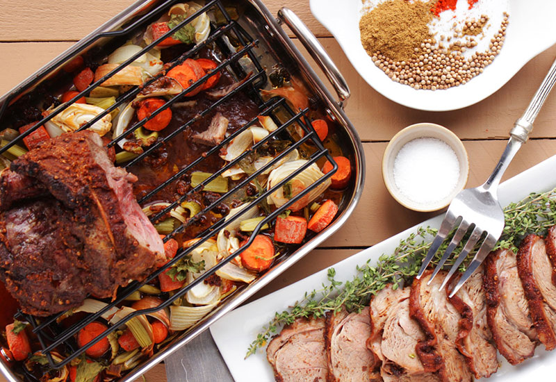 Burger with bacon, tomato, salmon, lettuce, and a creamy sauce.