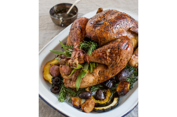 Cooked turkey over root vegetables