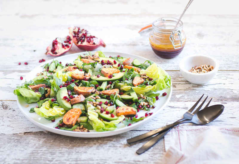 Arugula Salad with Caramelized Sweet Potato, Avocado and Pomegranate Ginger Vinaigrette