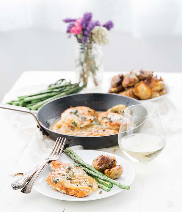 Chicken Piccata Meal on a Set Dinner Table