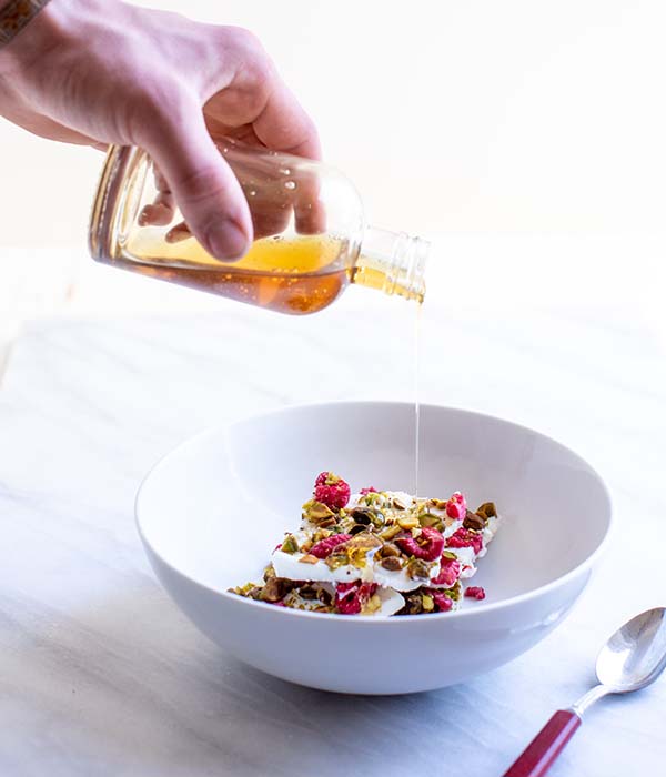 Greek Yogurt Bark in Bowl with Honey Drizzle