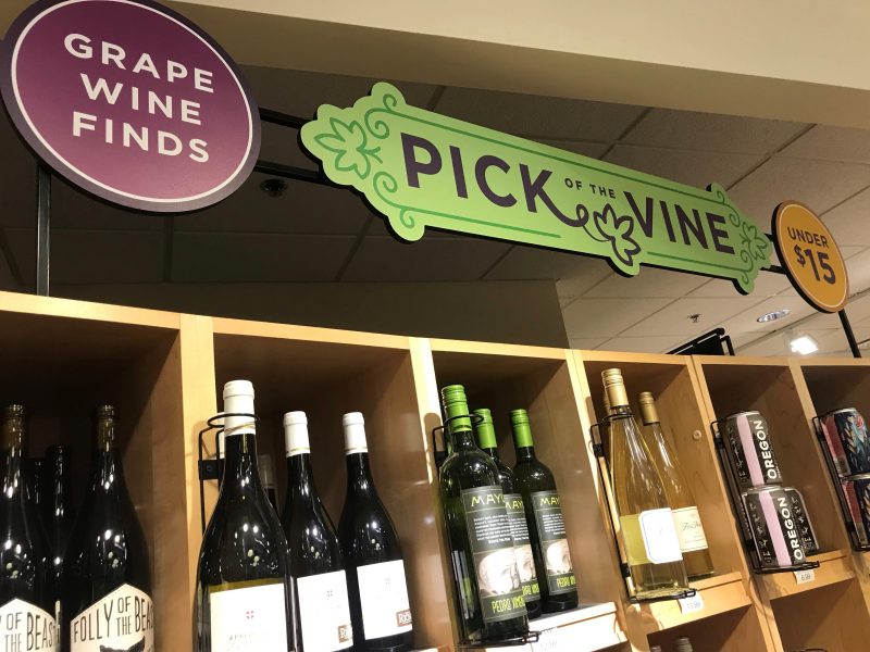 Heinen's Wine Department with signs that read "Grape Wine Finds." "Pick of the Vine," and "Under $15."