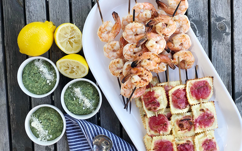 Grilled Shrimp with Heinen’s Ravioli and Walnut Pesto