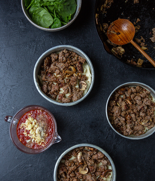 Pizza Pot Pie Ingredients being assembled in bowls