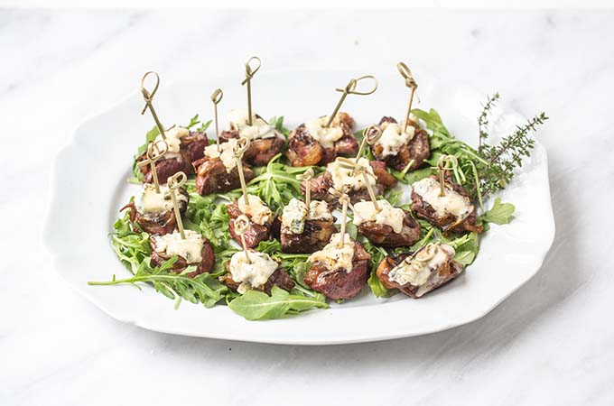 Bleu Cheese Steak Bites on Plate wirth Aurugula