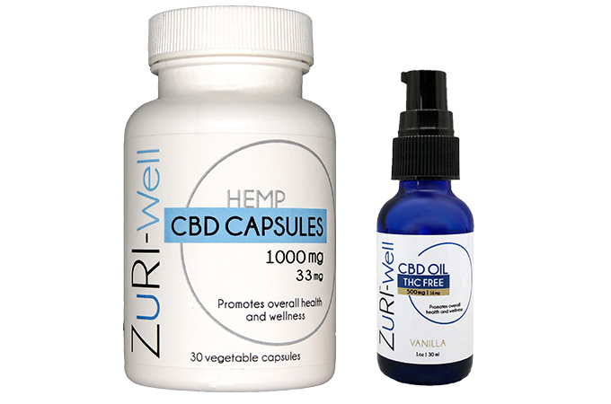 Zuri-Well hemp CBD capsules bottle next to a CBD oil THC-free spray.