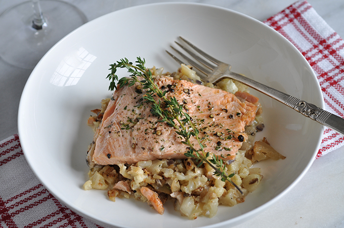 Citrus Marinated Ruby Trout on a bed of veggies topped with dill.
