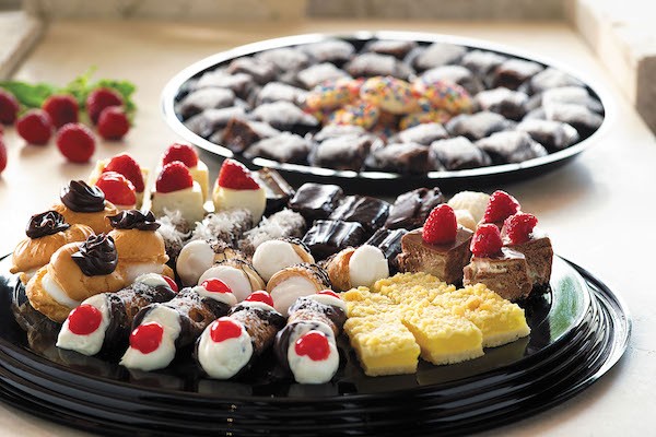 Bakery tray with cream puffs and other assorted baked goods