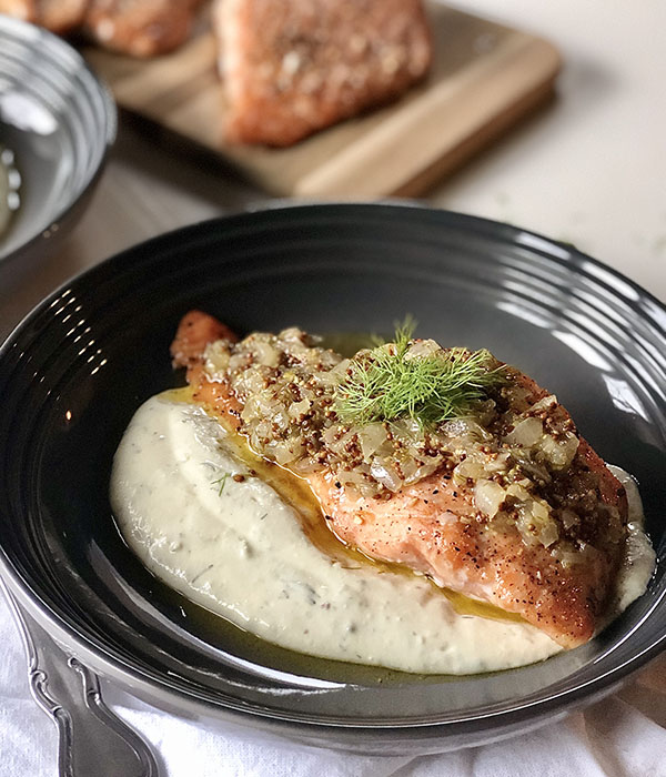 Salmon fillet topped with a Dijon, lemon, shallot mixture and served on a lemon dill cream sauce.