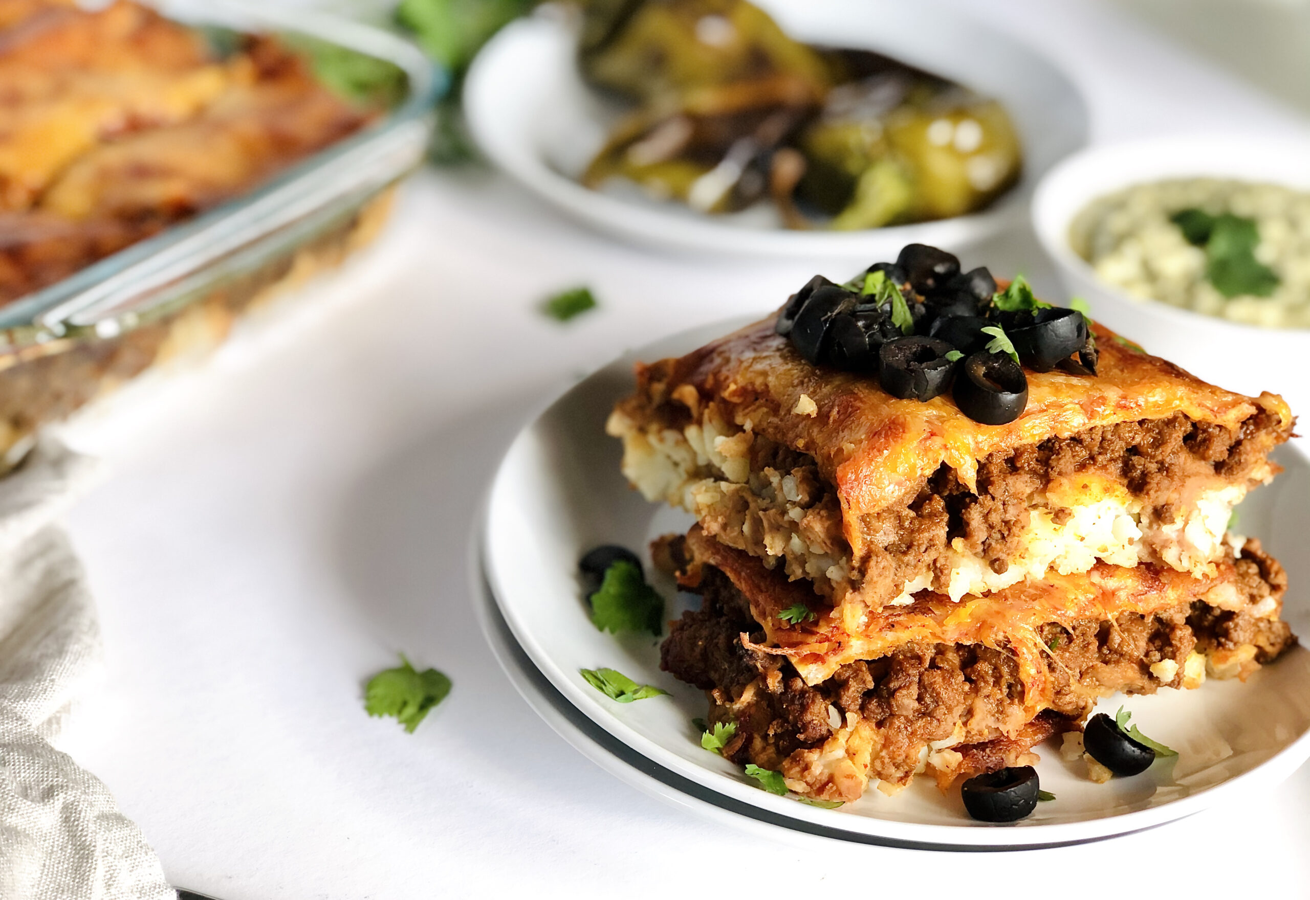 Sheet Pan Tater Tot Taco Pizza with Hatch Chile Avocado Crème