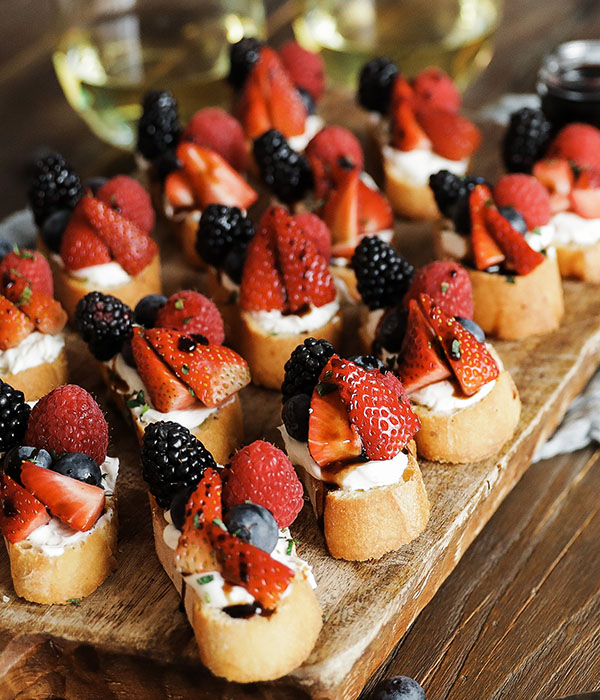 French bread topped with goat cheese, strawberries, blueberries, blackberries and balsamic glaze.