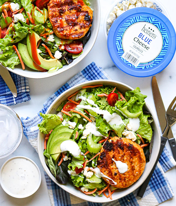 Buffalo Chicken Burger Bowls in a Serving Bowl with a Knife. 
