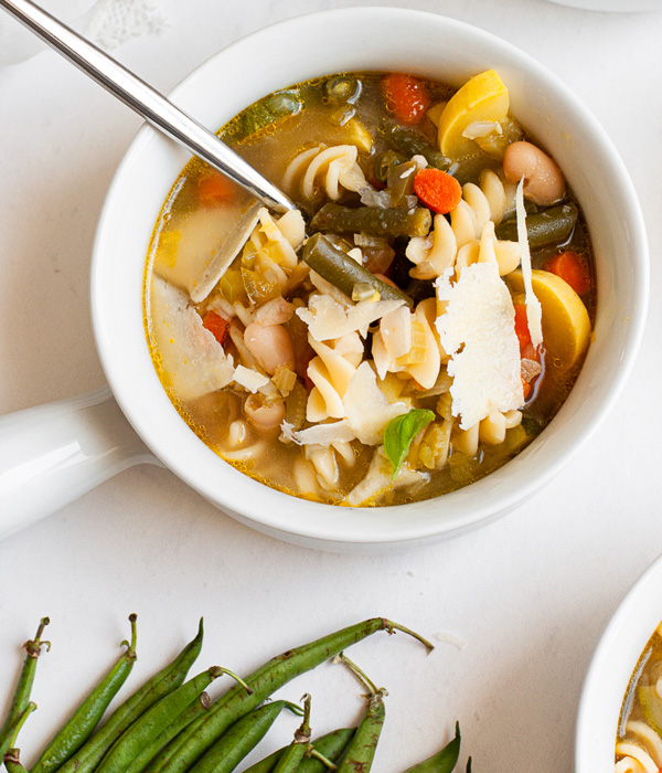 Minestrone with green beans, carrots, beans, and rotini noodles with fresh parmigiano Reggiano.