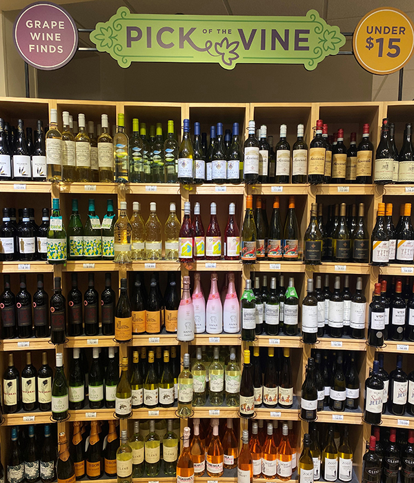 Heinen's Wine Department with signs that read "Grape Wine Finds." "Pick of the Vine," and "Under $15."