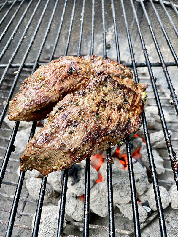 Bistro fillet being cooked on a grill.