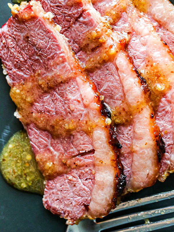 Sliced corned beef drizzled with honey mustard sauce.