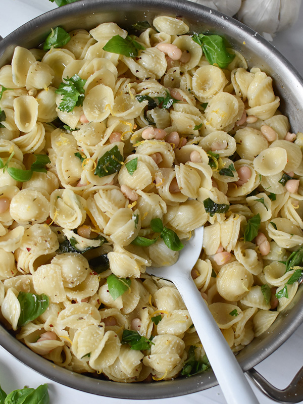 Lemon Basil Pasta in a pot with a serving spoon.