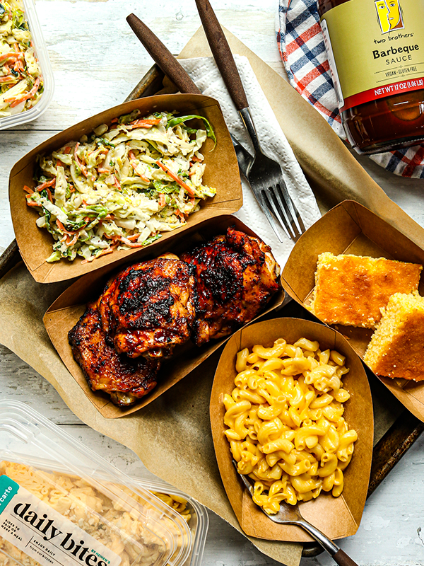 Platter with BBQ Chicken, mac and cheese, corn bread and coleslaw.