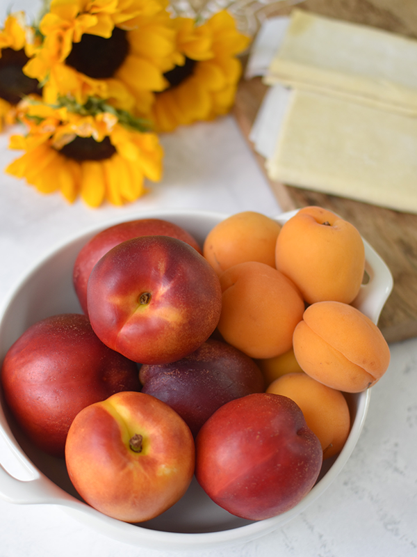 Bowl of peaches and apricots.