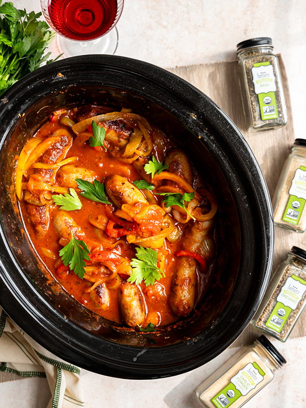 Sausage and peppers with sauce in crockpot.