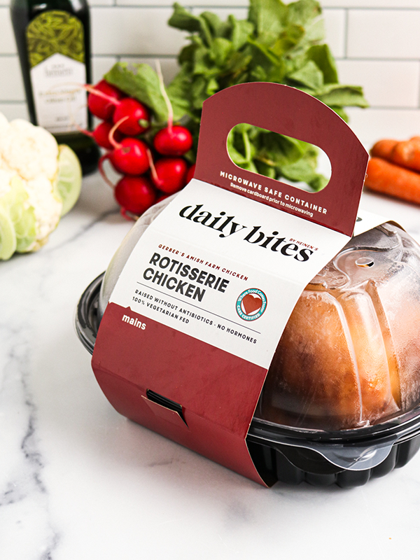 Daily Bites packaged rotisserie chicken on a kitchen counter.
