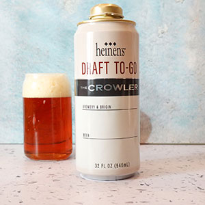 Heinen's Draft Beer Growler Beside a Glass of Beer