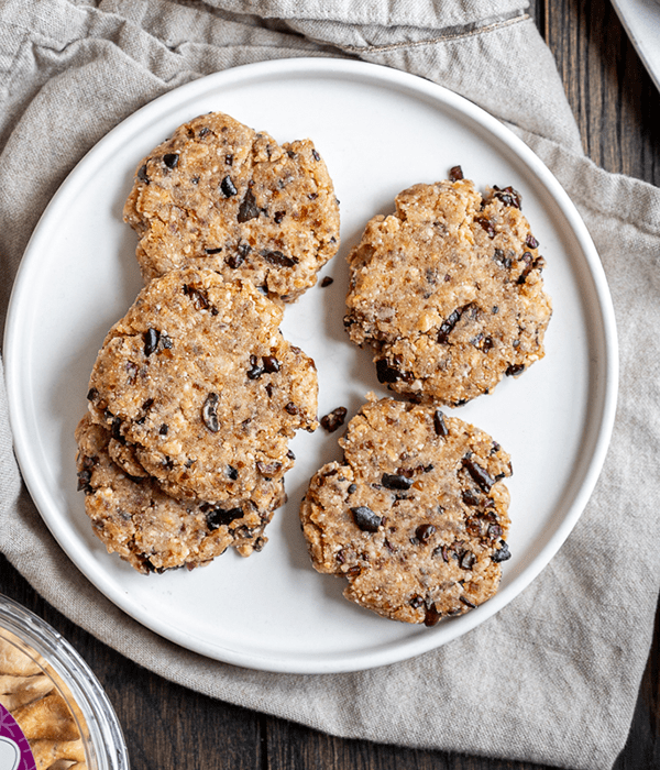 Several No Bake Chocolate Chip Cookies on A Large Round White Plate