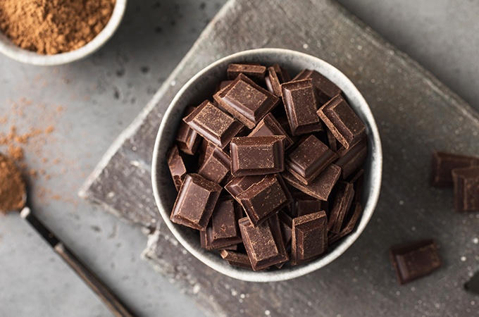 Dark chocolate cubed in a bowl