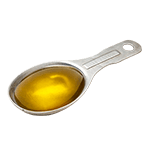 A measuring spoon of olive oil.