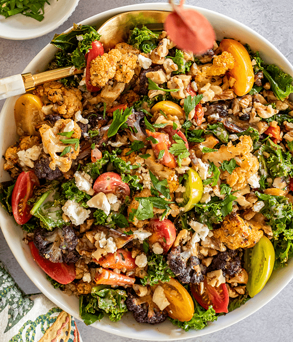 A Top-Down Image of a Roasted Cauliflower Salad in a Large Serving Bowl