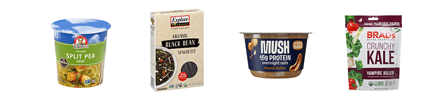 Plant-based snacks, roups and ready-made meals including: Dr. McDougall's vegan split pea soup, Explore Cuisine black bean pasta, MUSH peanut butter overnight oats and Brad's vampire killer crunchy kale.