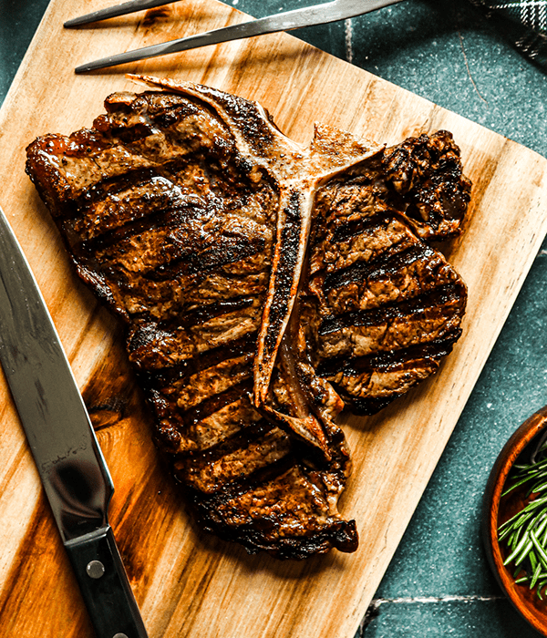 Heinen's Grilled Porterhouse Steak on a Cutting Board