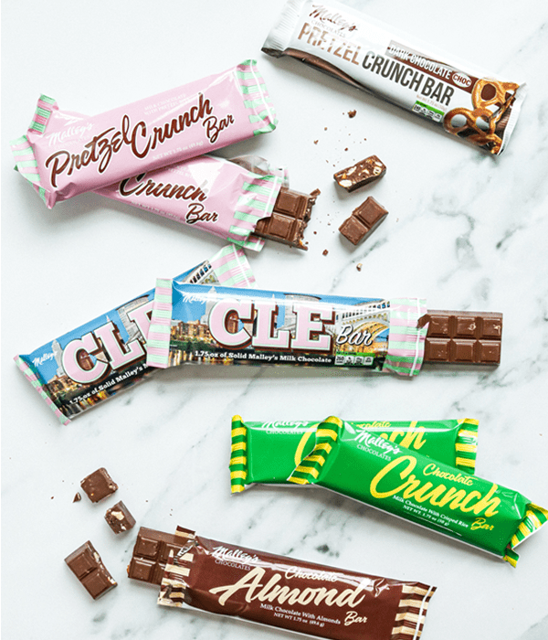 8 Malley's chocolate bars in a variety of flavors: dark chocolate pretzel crunch, milk chocolate pretzel crunch, CLE bar, chocolate crunch, and chocolate almond