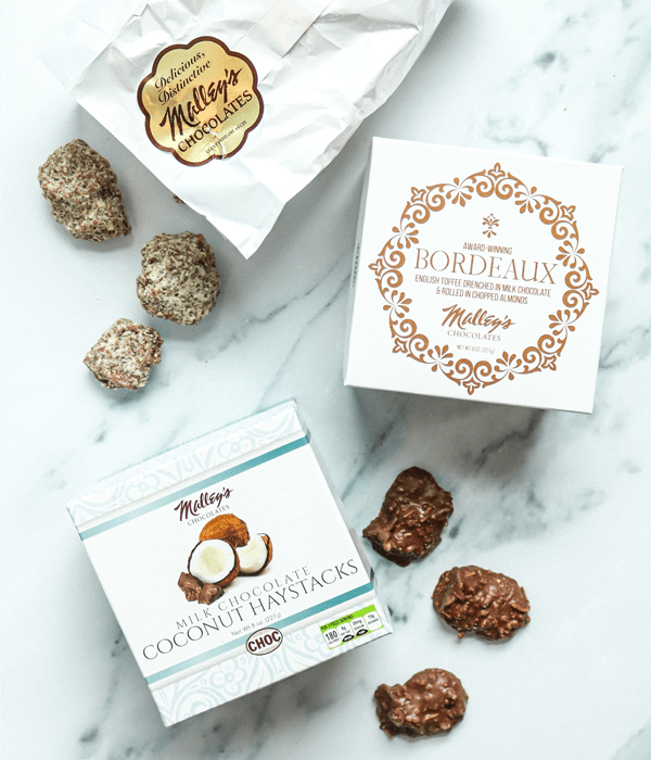 Malley's Chocolates bag, and a box of Bordeaux chocolates and milk chocolate coconut haystacks