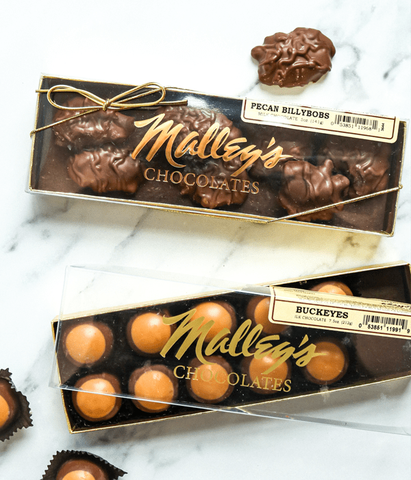 Two boxes of Malley's Chocolates: Pecan Billybobs and Buckeyes