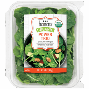 Packaged leafy vegetables containing Spinach, Kale, and Arugula. Label says Organic Power Trio, Triple Washed, Ready-to-eat.