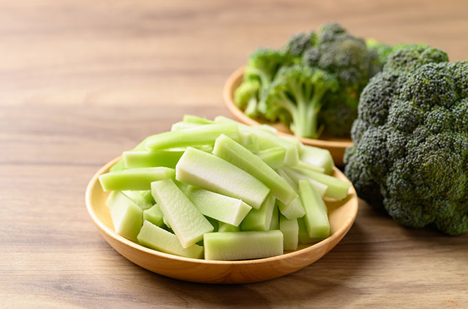 Broccoli stalks chopped in a bowl