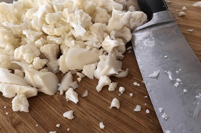 Chopped Cauliflower Stalks on a Cutting Board