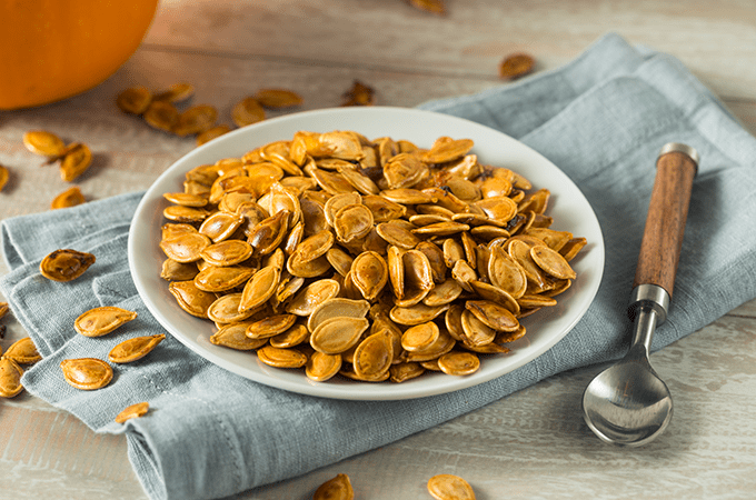 Roasted Pumpkin Seeds in a Small Shallow Bowl