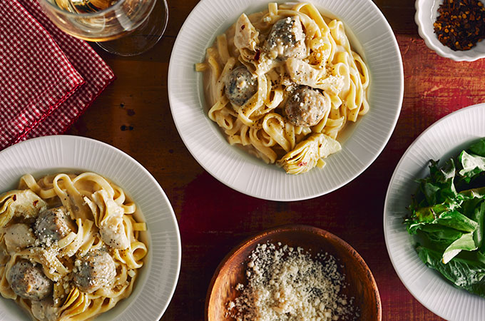 Bowl of linguini with chicken meatballs in truffle cream