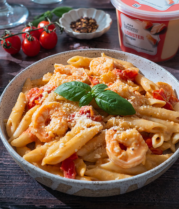 Large bowl of lobster bisque pasta and a container of Heinen's classic lobster bisque