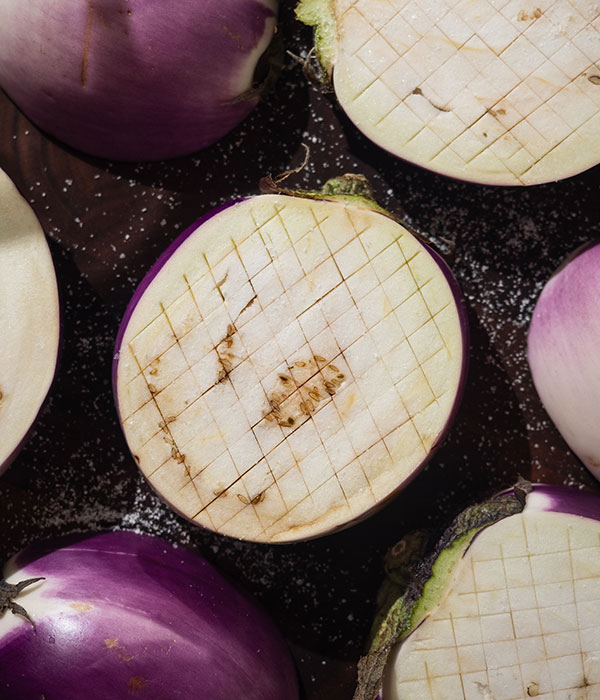 Sliced, scored, and grilled eggplant