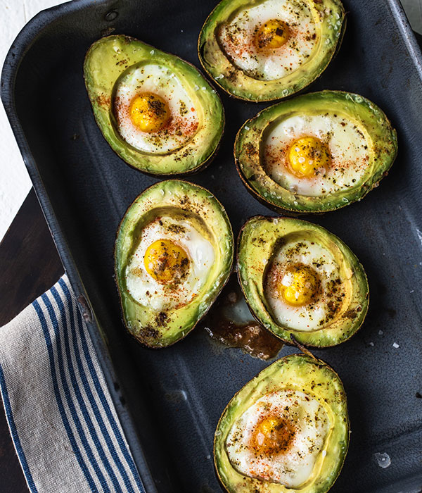 Baked avocados with egg in a pan