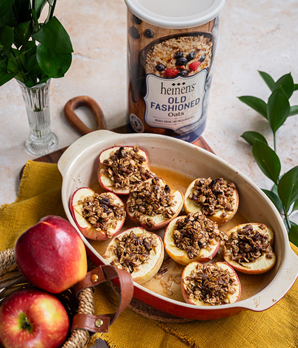 Container of Heinen's old fashioned oats and a pan of oatmeal stuffed apples