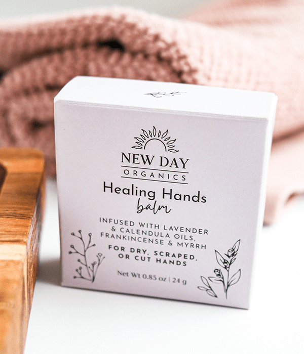 A Box of New Day Organics Healing Hands Balm
