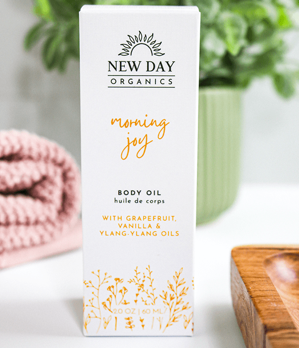 A Box of New Day Organics Morning Joy Body Oil